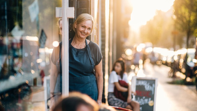Lady smiling outside cafe Lady smiling outside cafe